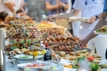 catering wedding buffet with variety of food snacks and appetizers