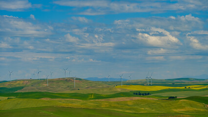 Wind turbines providing green power set among the fertile farmland of the Palouse Region in...