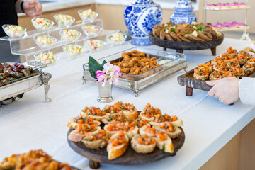 catering buffet with different food snacks and appetizers on table