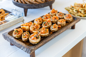 catering buffet with different food snacks and appetizers on table