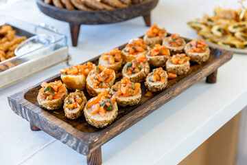 catering buffet with different food snacks and appetizers on table