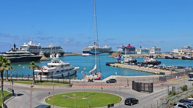 CICITAVECCHIA, ITALY - MAY 22, 2024: Cruise ships and luxury Yachts in harbor at Civitavecchia, Italy on a quiet day under a clear blue sky