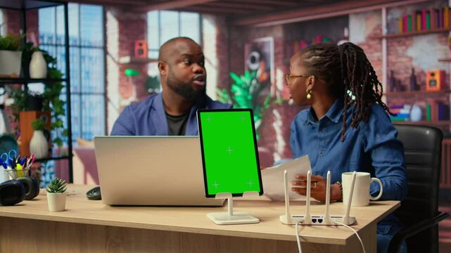 Black man and woman getting angry at home internet next to mockup screen, identifying weak connection and testing different troubleshooting techniques to fix their network errors. Camera A.