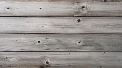 a wooden surface, showcasing a vertical layout of four wide planks. The wood has a weathered and rustic appearance, with a predominantly light gray color, interspersed with subtle variations in tone. 