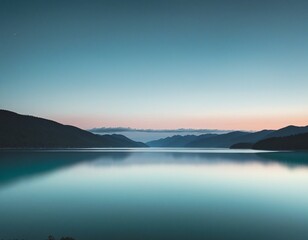 Fototapeta premium Tranquil Evening: A Smooth Transition from Blue to Teal Above the Water
