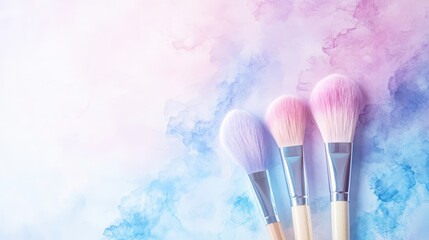 Three vibrant makeup brushes with pastel bristles on a dreamy watercolor background, creating a soft and artistic mood.
