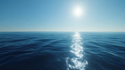 Obraz premium A tranquil scene of the vast ocean, showcasing serene blue waters under a bright sun, creating a peaceful and calming atmosphere.