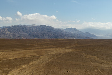 The view of the Andes Mountains from desert-like areas of south Peru