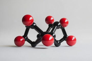 Red-black molecule model studio shot, science education