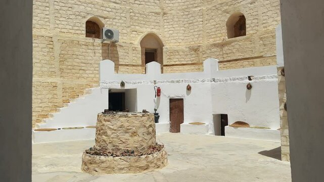 Explore a serene traditional Berber courtyard located in Matmata, Tunisia