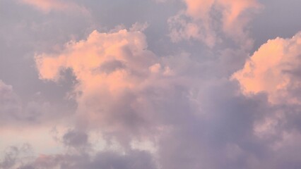 Clouds lit orange by the sunset over the lake