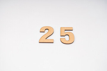 Number twenty-five in paper on a white background.