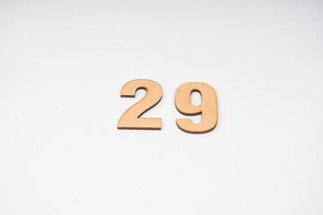 Number twenty-nine in paper on a white background.