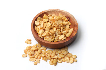 salted broad beans close up in a wooden bowl. top view, good for recipe or commercial, isolated on white background