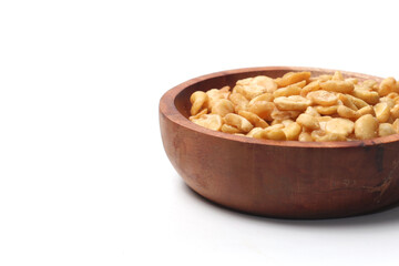 salted broad beans close up in a wooden bowl. side view, good for recipe or commercial, isolated on white background