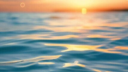 Close slow motion video clear blue water rippling warm orange glow sunset highlighting calm reflective atmosphere scene