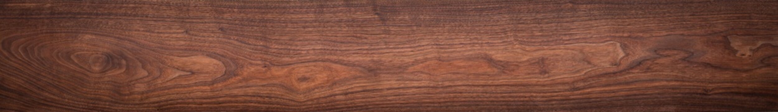 Walnut wood texture. Extra long walnut wood plank natural texture background. Long wood plank texture.
