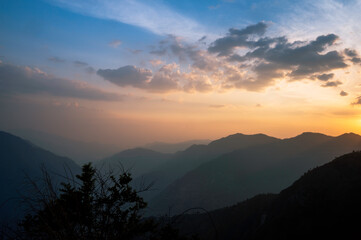 Sunset in the mountains of the Himalayas. Village Bhatkanda, Sainj valley, Kullu district, Himachal Pradesh, India.