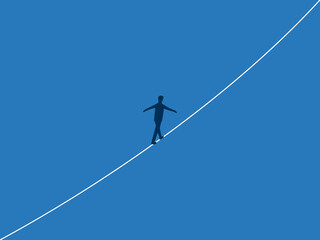 Take risks, Focused businessman walking on a single tightrope