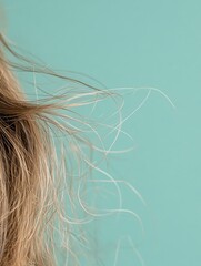 Fototapeta premium Close up view of frayed hair tips showcasing split ends with soft pastel background for creative text editing. Generative AI