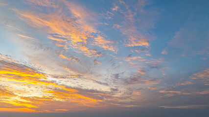 Aerial view A breathtaking view of a coastal city at sunset, with golden hues illuminating the sky...