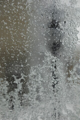 snowflakes melt on the window