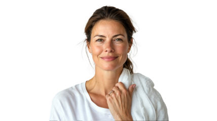 portrait of a woman in her 40s massaging a facial oil as part of her skincare routine, wearing a casual white t-shirt with a towel over her shoulders, smiling with glowing skin, isolated on a white ba