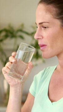 Pregnant woman with glass of water
