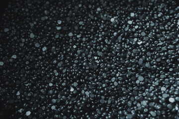 Dark silver abstract background of metallic Wax Granules