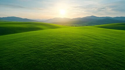 Naklejka premium Sunrise Over Lush Green Hills and Fields
