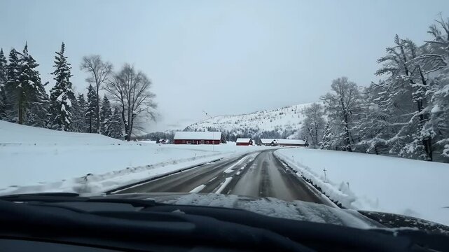 valley road winter storm rural driving point perspective rural mountain farming community emphasizing seasonal cold ather snow ice road landscape