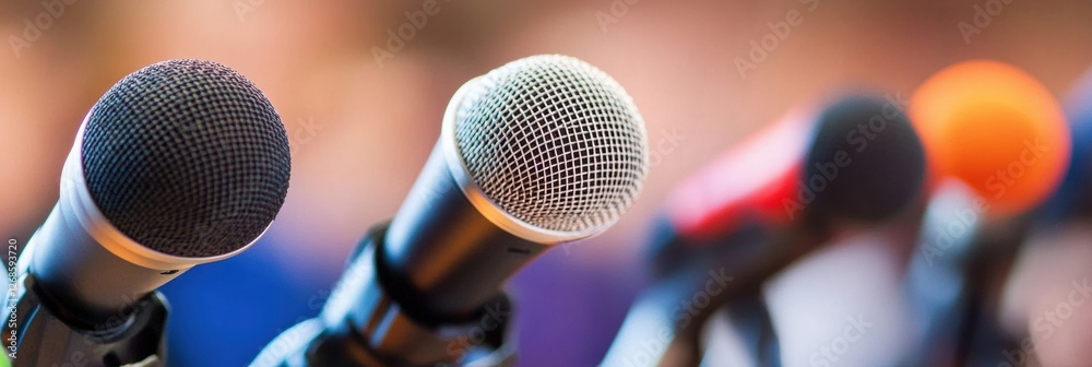 Poster Multiple microphones arranged for an event presentation at a conference center in the afternoon. Generative AI