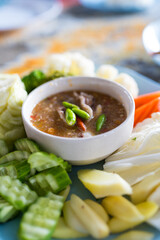 Thai cuisine spicy crab roe serve with fresh vegetable. Nice healthy meal, Thai seafood style