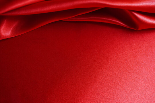 abstract background red silk or satin velvet. Luxurious, elegant. Curtains, curtains, flowing waves background work or backdrop work
