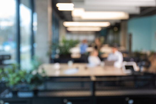 Blurred office background with employees