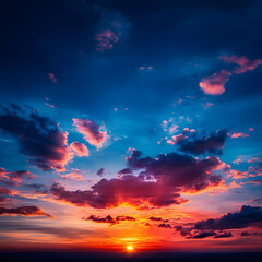 Naklejka premium Vibrant Sunset Sky with Red Orange and Blue Clouds