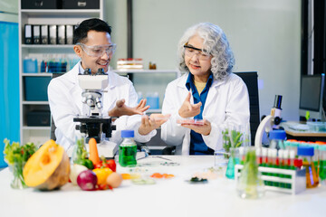 Food scientists in lab coats, testing samples, and analyzing food safety and quality in a modern...