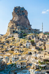 Fototapeta premium Uchisar Castle ancient rock fortress and traditional cave houses in Cappadocia, Turkey