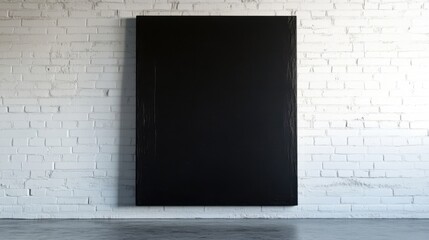 black canvas on white brick wall