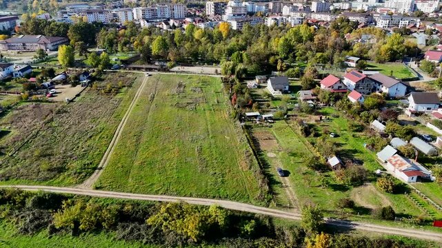 Ascending aerial footage of Ramnicu Valcea city in the south-central part of Romania, on a sunny day