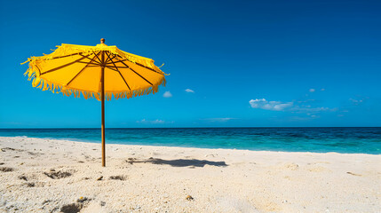 Fototapeta premium Yellow Beach Umbrella on Sunny Tropical Shore