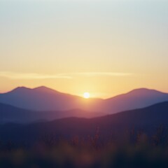 Golden Sunrise Over Mountain Ridges with Wild Grass in Foreground Scenic View