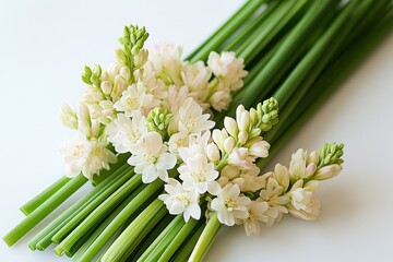 Obraz premium Freshly cut white flowers arranged beautifully on a clean surface ready for use in floral arrangements, decorations, or gifts during springtime celebrations