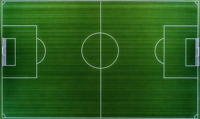 Obraz premium Aerial view of a soccer field with white markings.