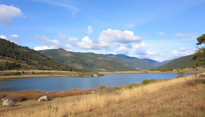 Obraz premium A serene body of water set against a backdrop of majestic mountains