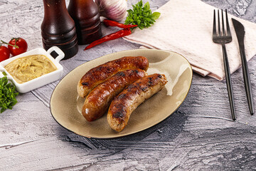 Delicous natural roasted sausages in the plate