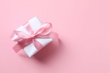 Beautiful gift box on pink background