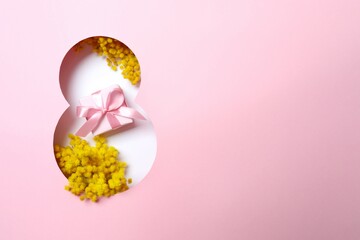 8 March greeting card design with mimosa flowers and gift box, top view. Happy International Women's Day