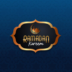Elegant Ramadan Kareem design featuring a blue patterned background, a black ornate frame with gold accents, a crescent moon, a mosque silhouette, and golden text.Perfect for banners and greeting card