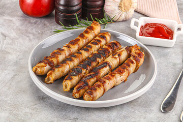 Grilled meat sausages wrapped bacon